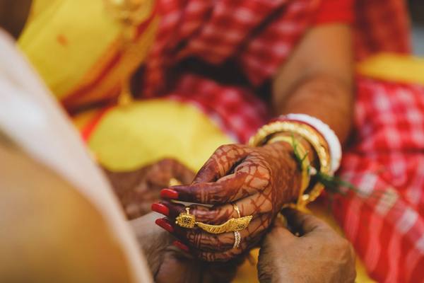 Close-up of an Indian wedding ceremonial ritual — documentary wedding photography by byag.studio, India
