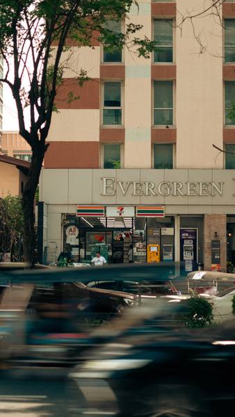 Long-exposure photograph of a 7-Eleven in Thailand — creative travel magazine photography by byag.studio